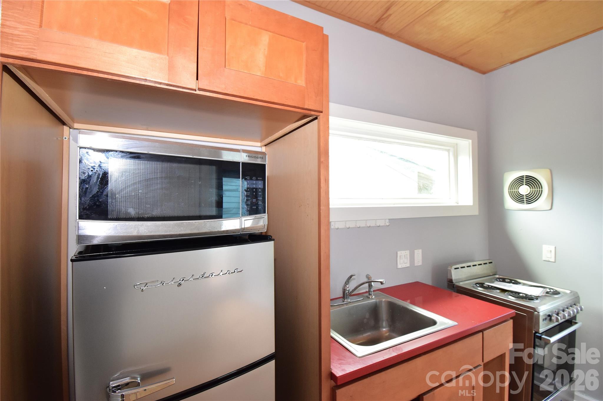 6 Belvedere Road Asheville, NC 28803 - Photo 6 of 33 a kitchen with a stove and a microwave