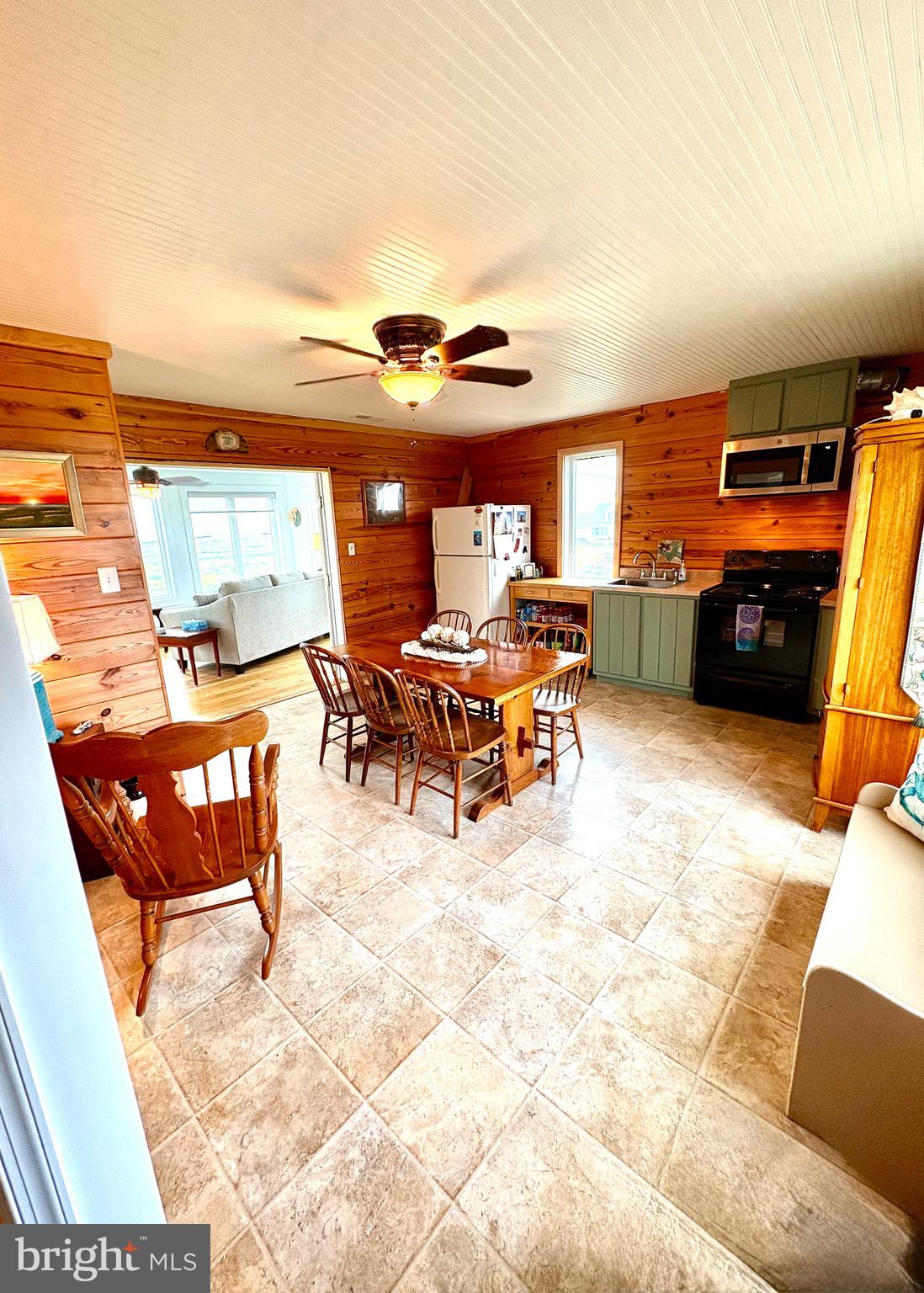 3419 Marsh Road Ewell, MD 21824 - Photo 13 of 34 a view of a terrace with furniture and a flat screen tv