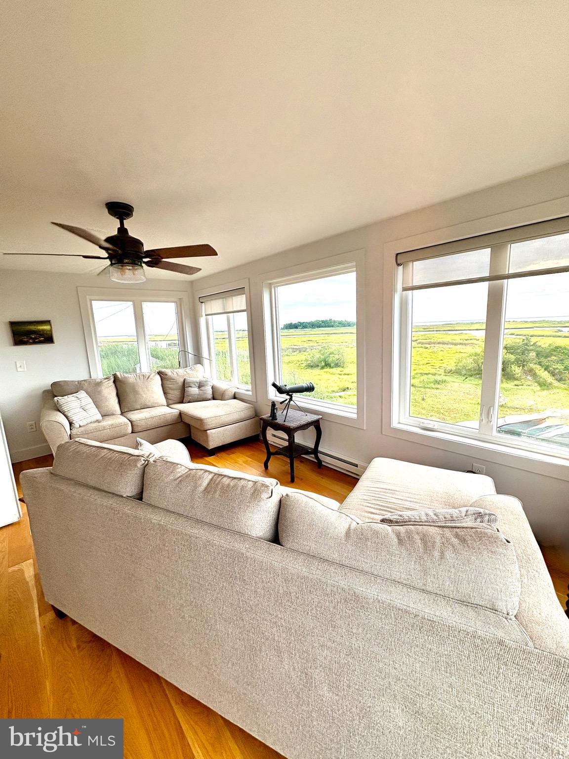 3419 Marsh Road Ewell, MD 21824 - Photo 18 of 34 a living room with furniture and a large window