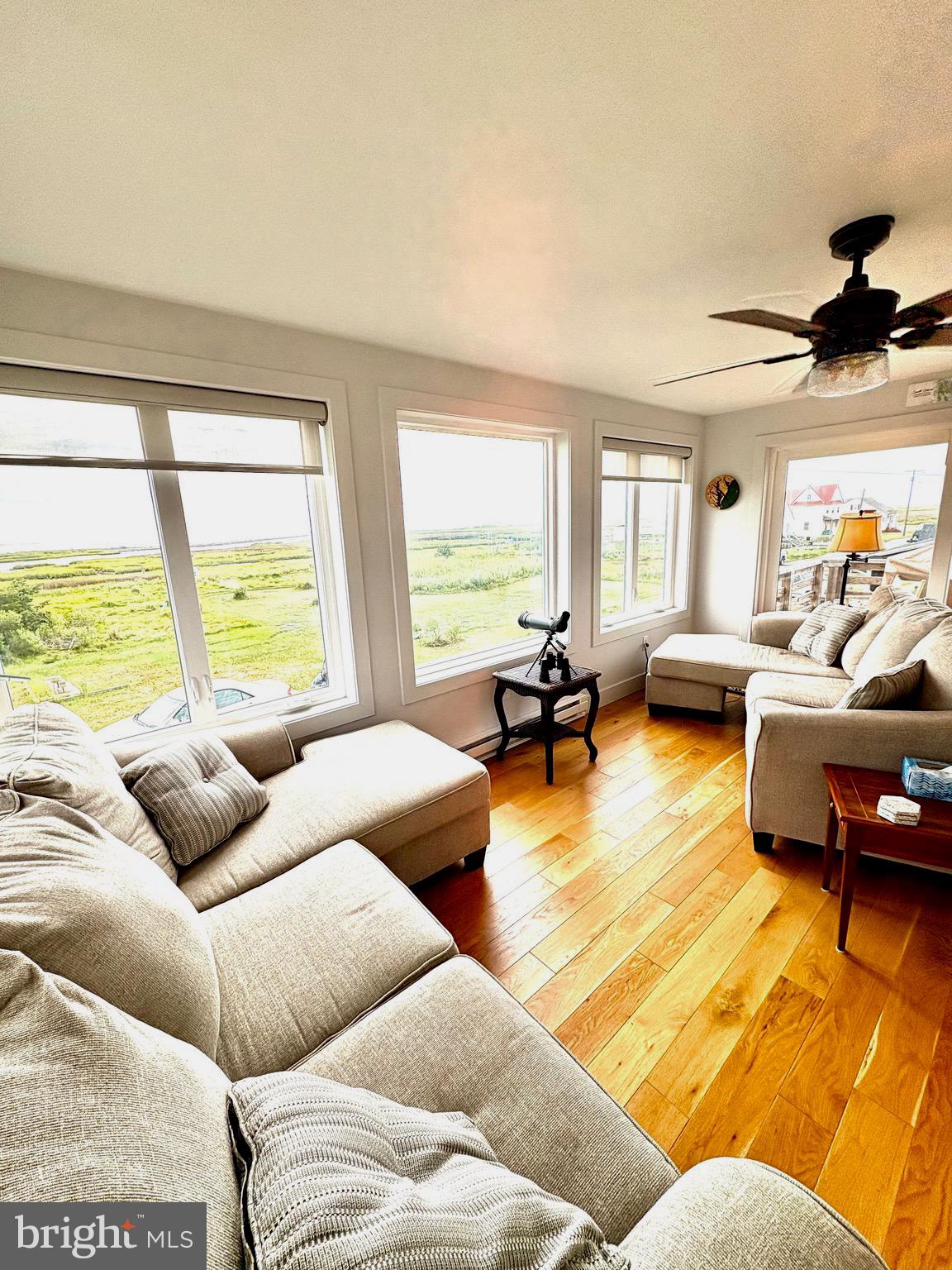 3419 Marsh Road Ewell, MD 21824 - Photo 2 of 34 a living room with furniture and a large window