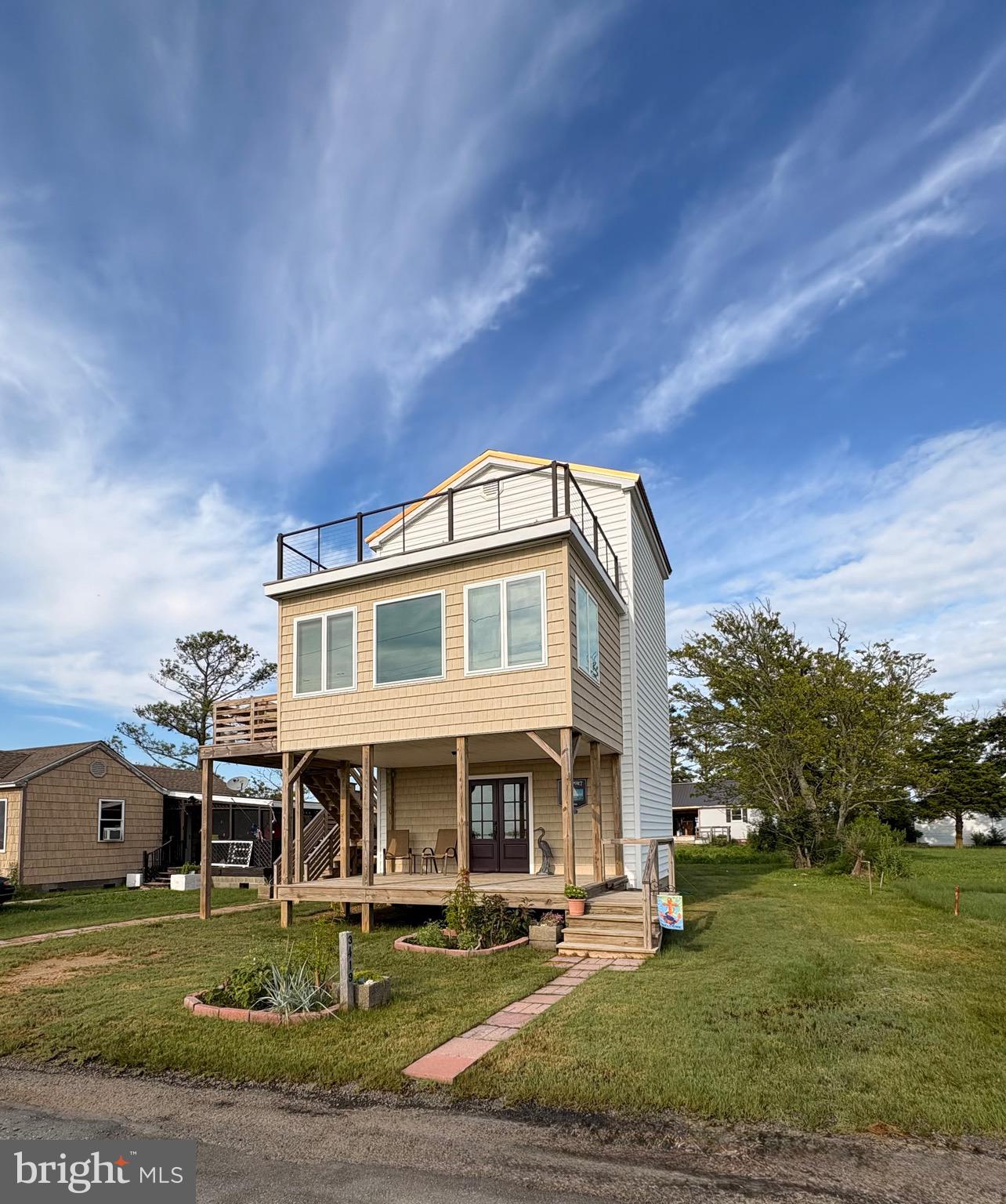 3419 Marsh Road Ewell, MD 21824 - Photo 5 of 34 a front view of a house with garden