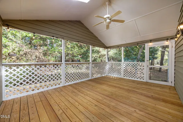 a view of a room with wooden floor and balcony