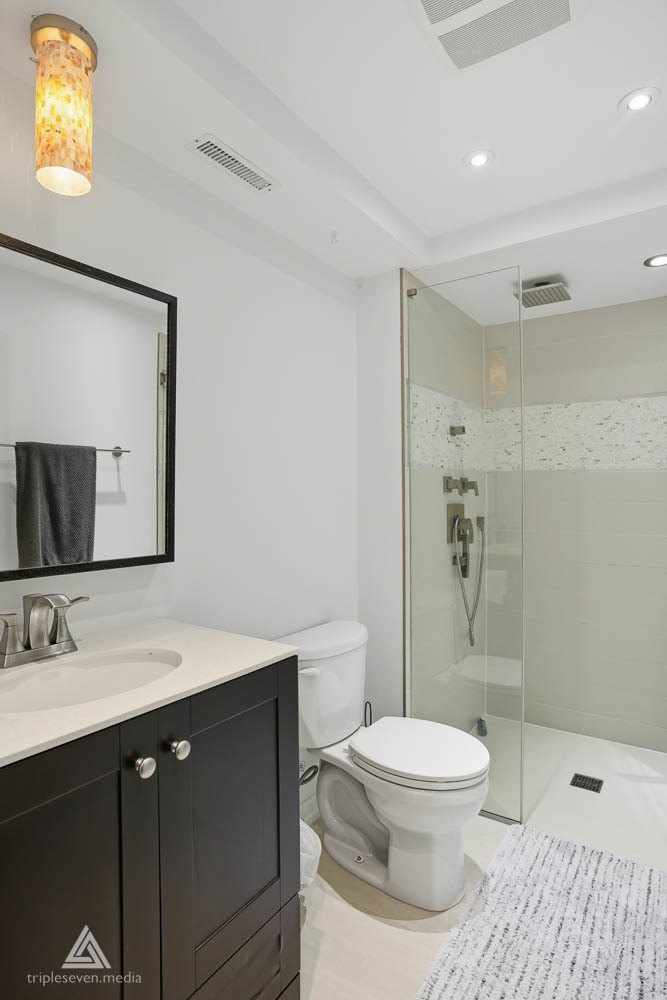 9180 S Road, Unit D Palos Hills, IL 60465 - Photo 15 of 24 a bathroom with a sink a toilet a mirror and shower