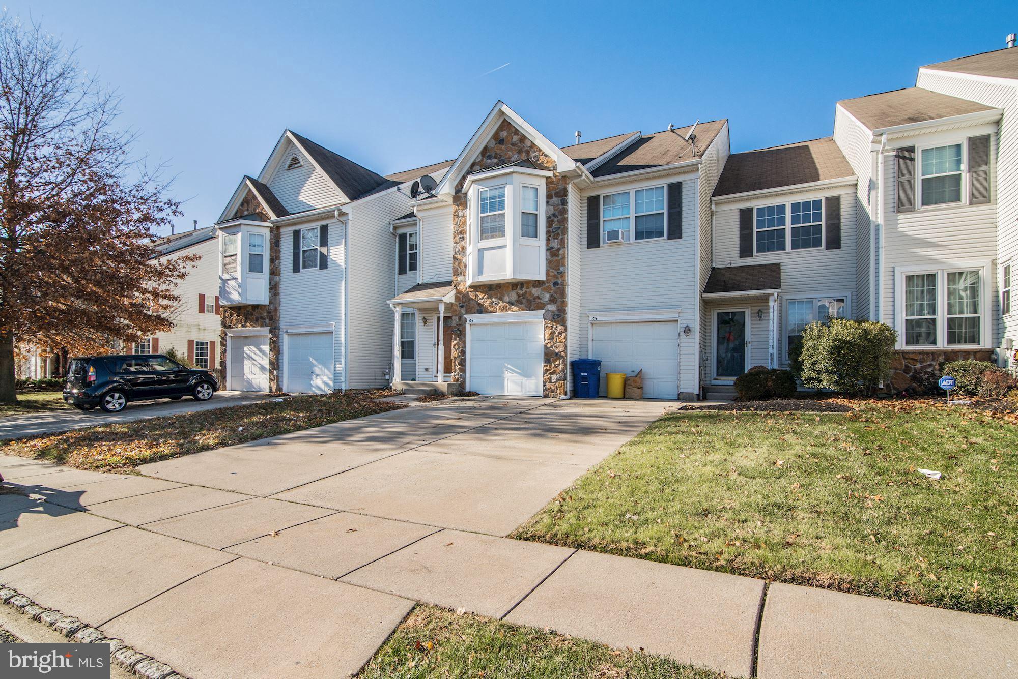 63 Threadleaf Terrace Burlington, NJ 08016 - Photo 2 of 34 a front view of a house with a yard