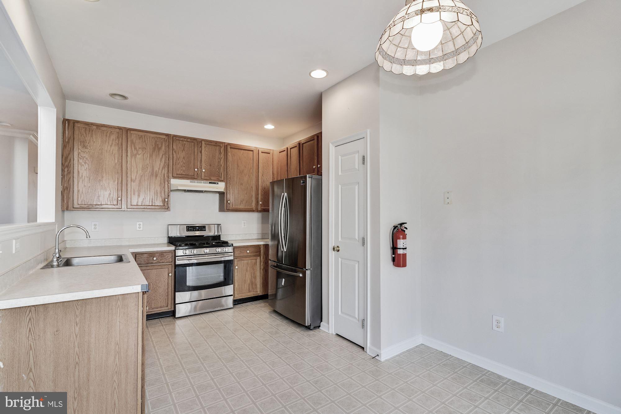 63 Threadleaf Terrace Burlington, NJ 08016 - Photo 11 of 34 a kitchen with stainless steel appliances a refrigerator stove and sink