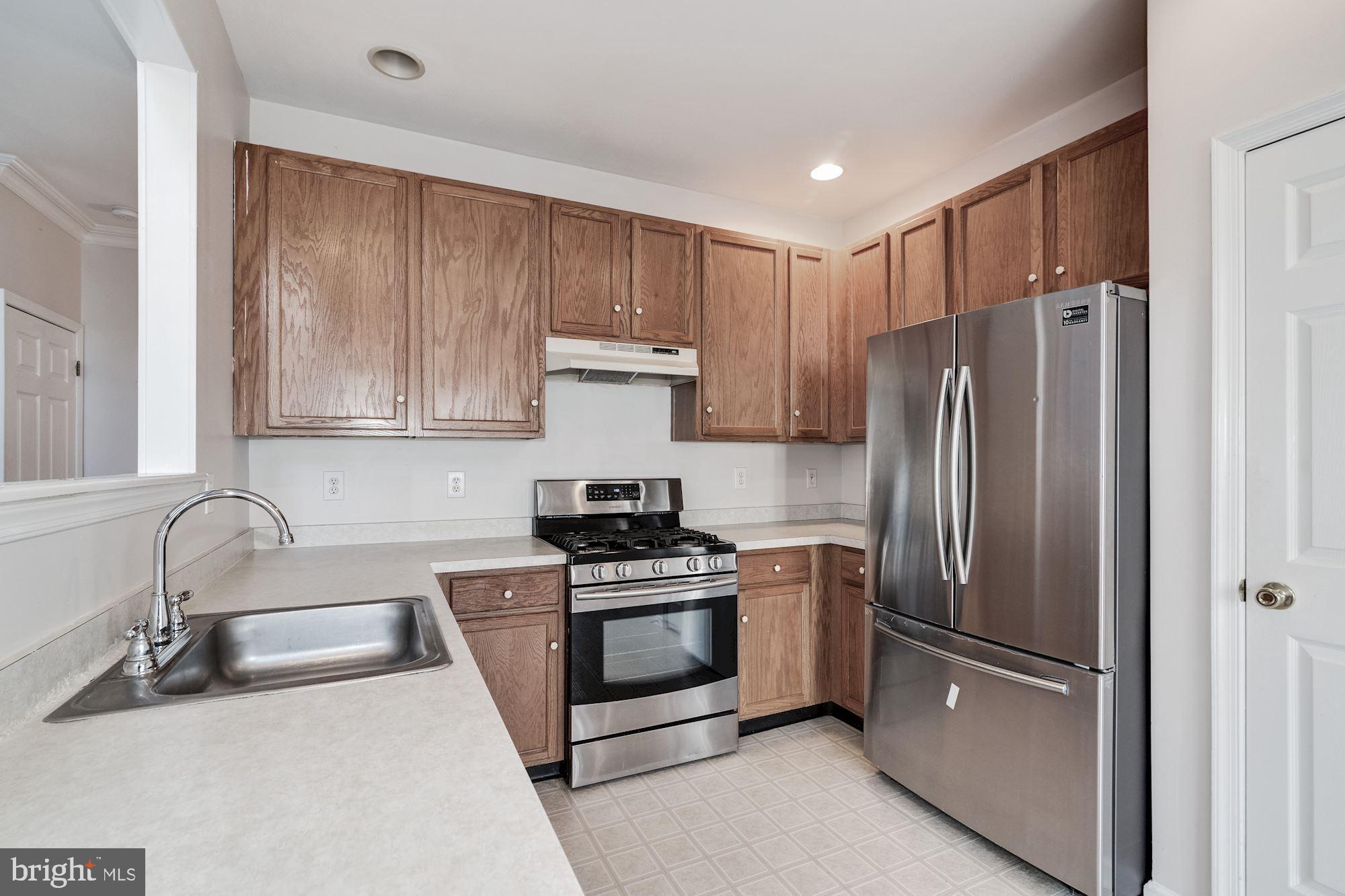 63 Threadleaf Terrace Burlington, NJ 08016 - Photo 15 of 34 a kitchen with stainless steel appliances granite countertop a refrigerator sink and stove