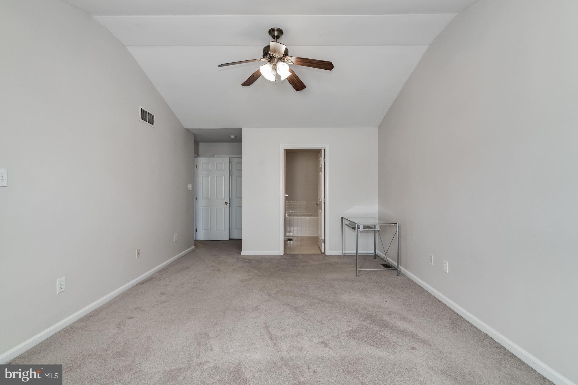 63 Threadleaf Terrace Burlington, NJ 08016 - Photo 20 of 34 an empty room with chandelier fan and windows