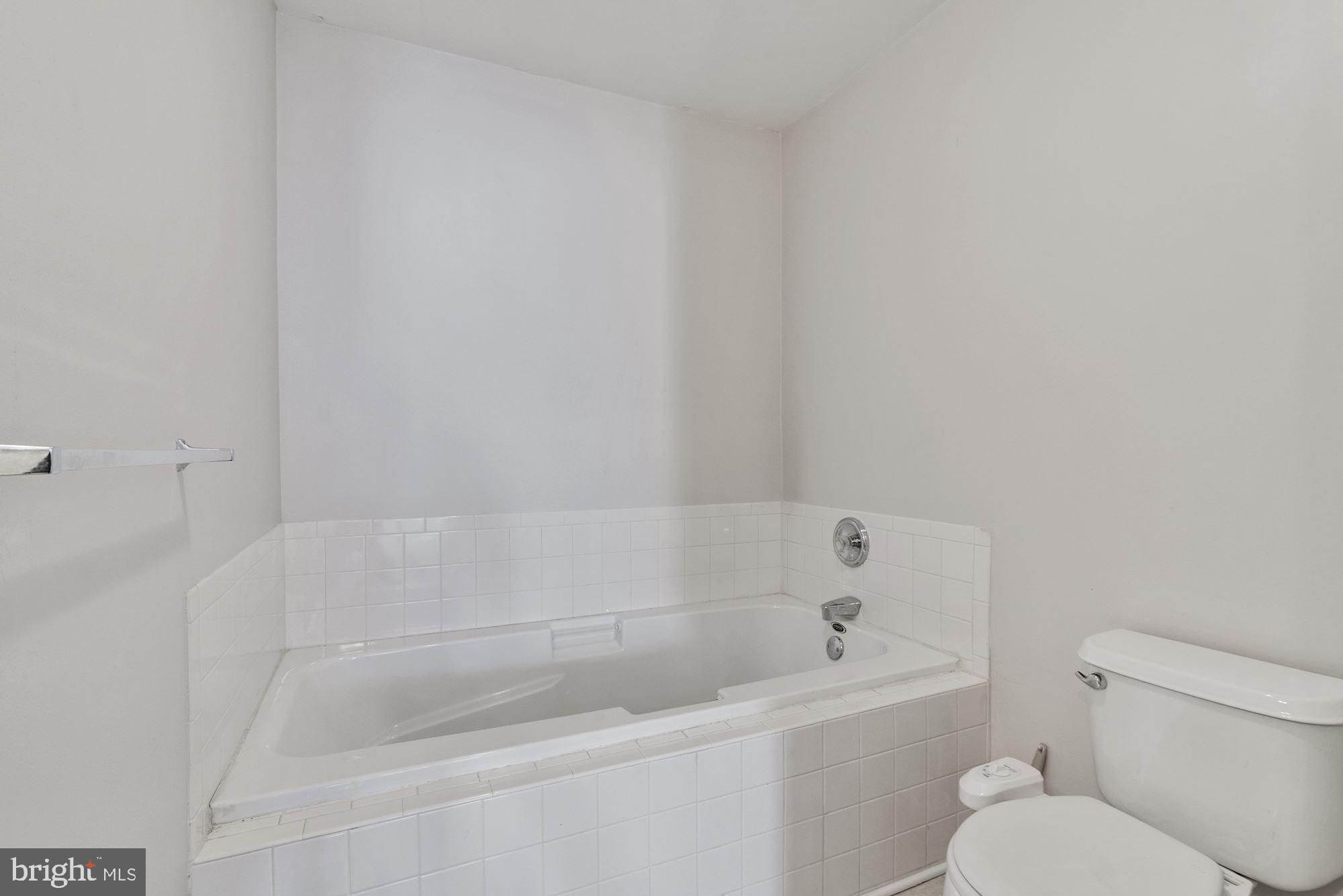 63 Threadleaf Terrace Burlington, NJ 08016 - Photo 23 of 34 a white bath tub sitting next to a white toilet and a sink