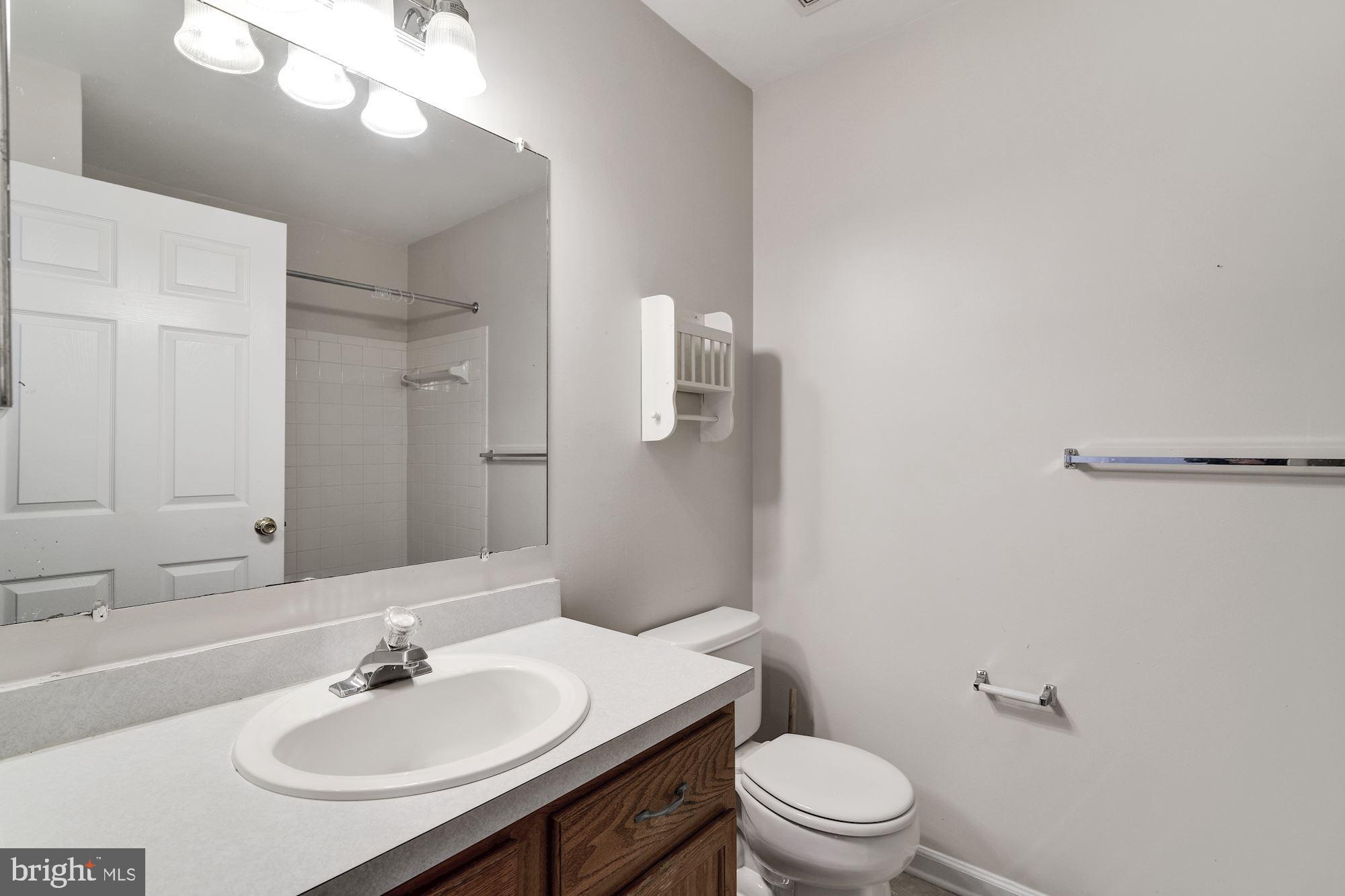 63 Threadleaf Terrace Burlington, NJ 08016 - Photo 29 of 34 a bathroom with a sink toilet and a mirror