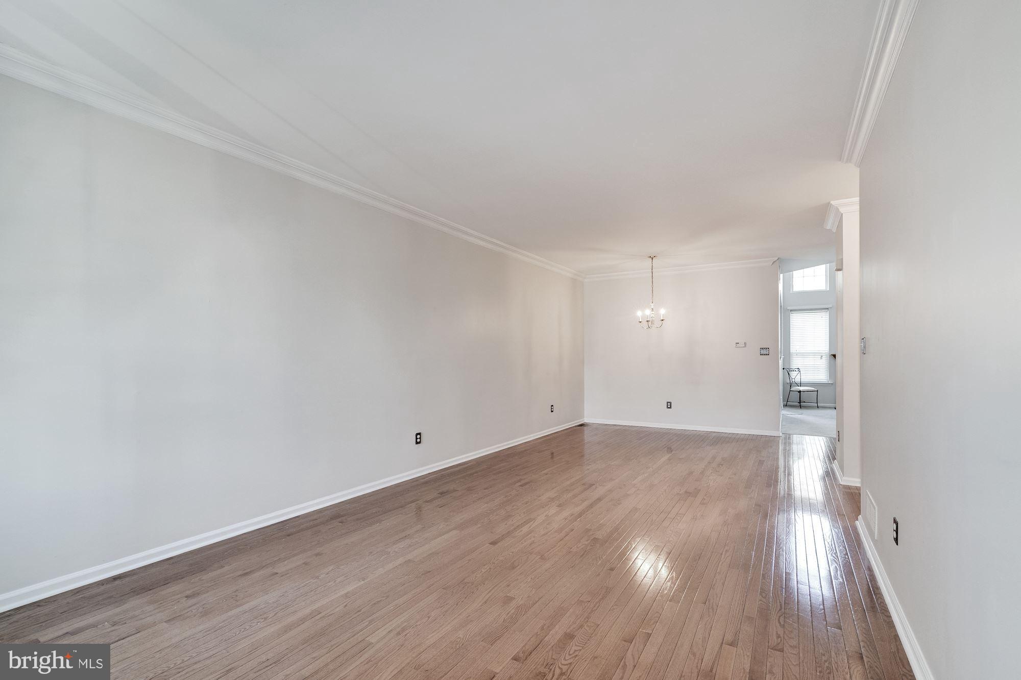 63 Threadleaf Terrace Burlington, NJ 08016 - Photo 5 of 34 a view of an empty room and wooden floor