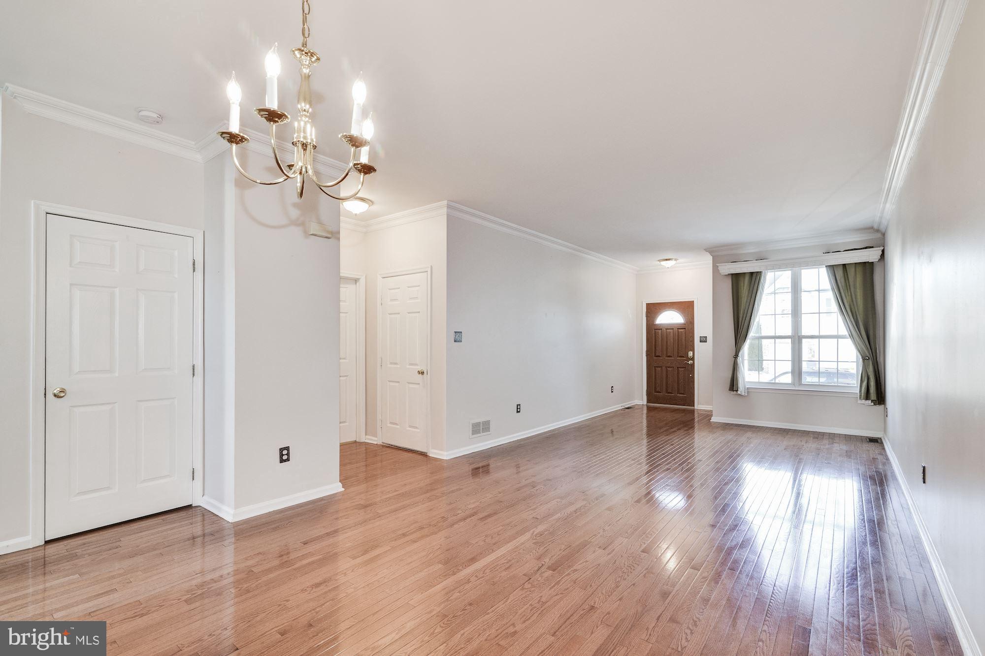 63 Threadleaf Terrace Burlington, NJ 08016 - Photo 6 of 34 a view of an empty room with wooden floor and a window