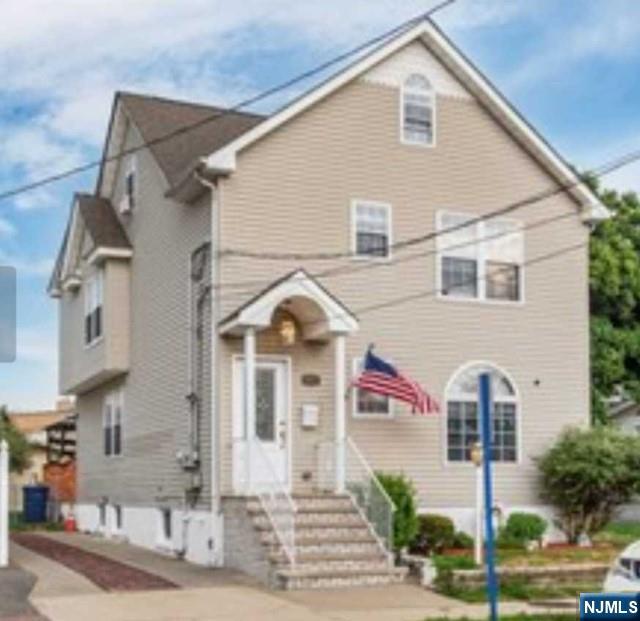 22 Broadway, Unit 2 Hackensack, NJ 07601 - Photo 1 of 8 a front view of a house with garden