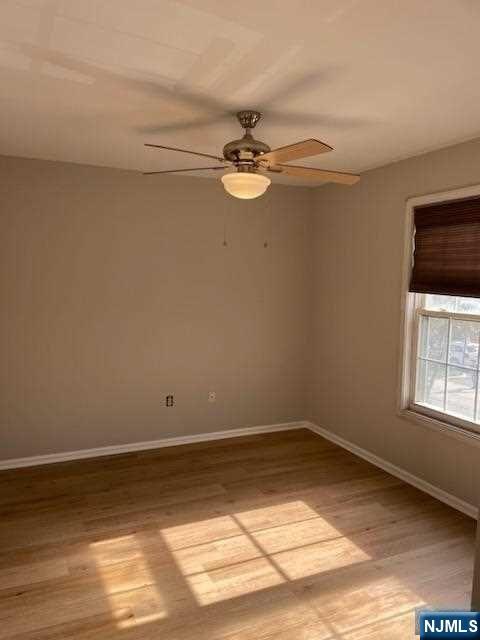 22 Broadway, Unit 2 Hackensack, NJ 07601 - Photo 6 of 8 a view of room with window and ceiling fan