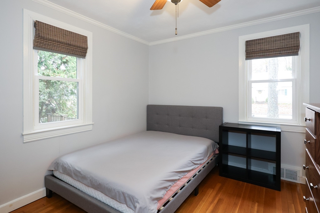 170 New Estate Road Littleton, MA 01460 - Photo 11 of 28 a large bed sitting in a bedroom next to a window