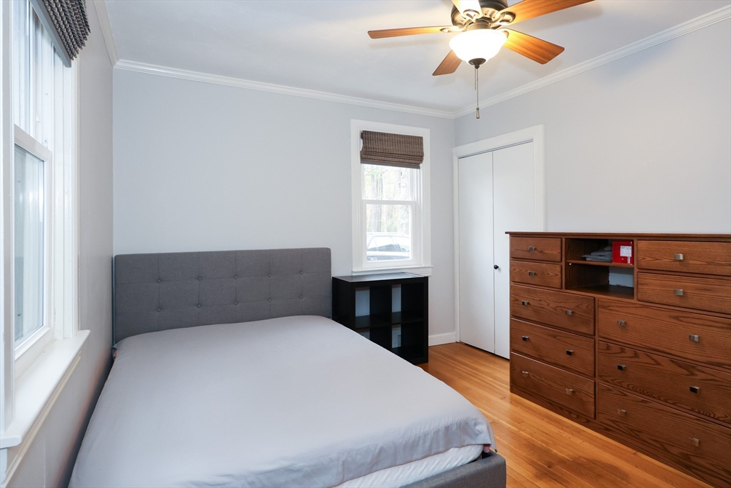 170 New Estate Road Littleton, MA 01460 - Photo 12 of 28 a bedroom with a bed and a dresser