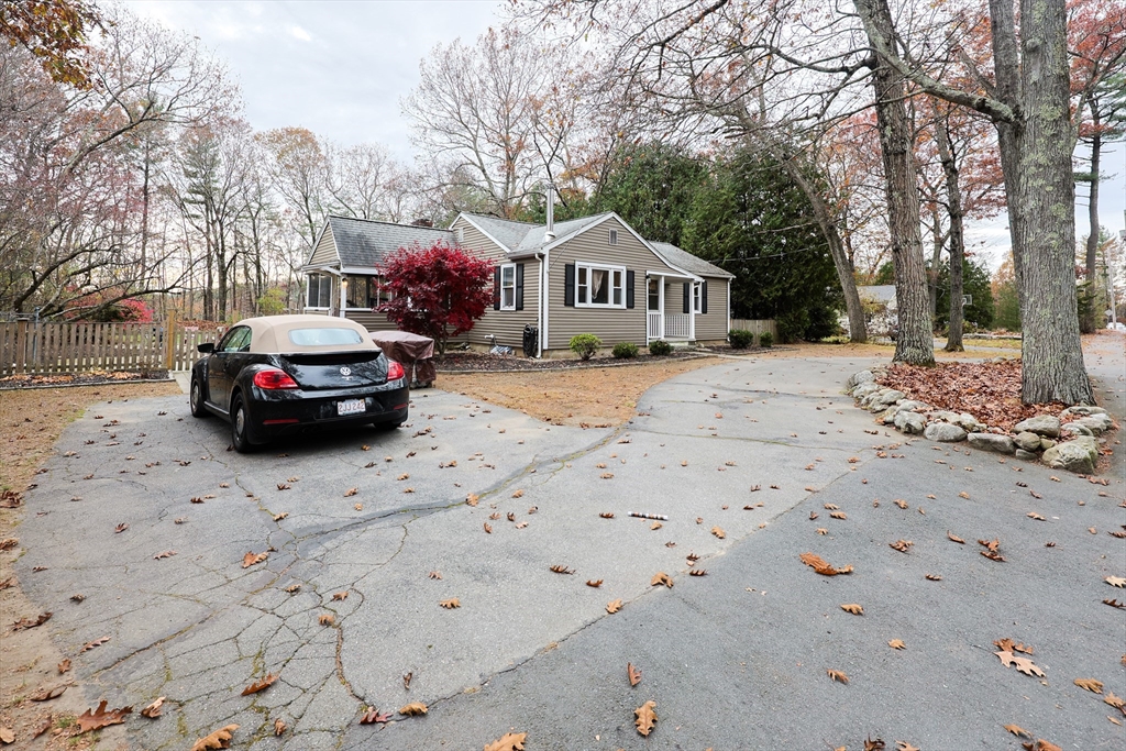 170 New Estate Road Littleton, MA 01460 - Photo 2 of 28 a front view of a house with a yard covered in snow