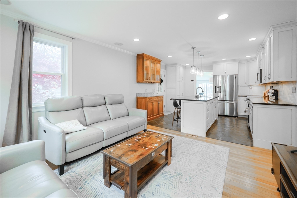 170 New Estate Road Littleton, MA 01460 - Photo 5 of 28 a living room with furniture and a wooden floor