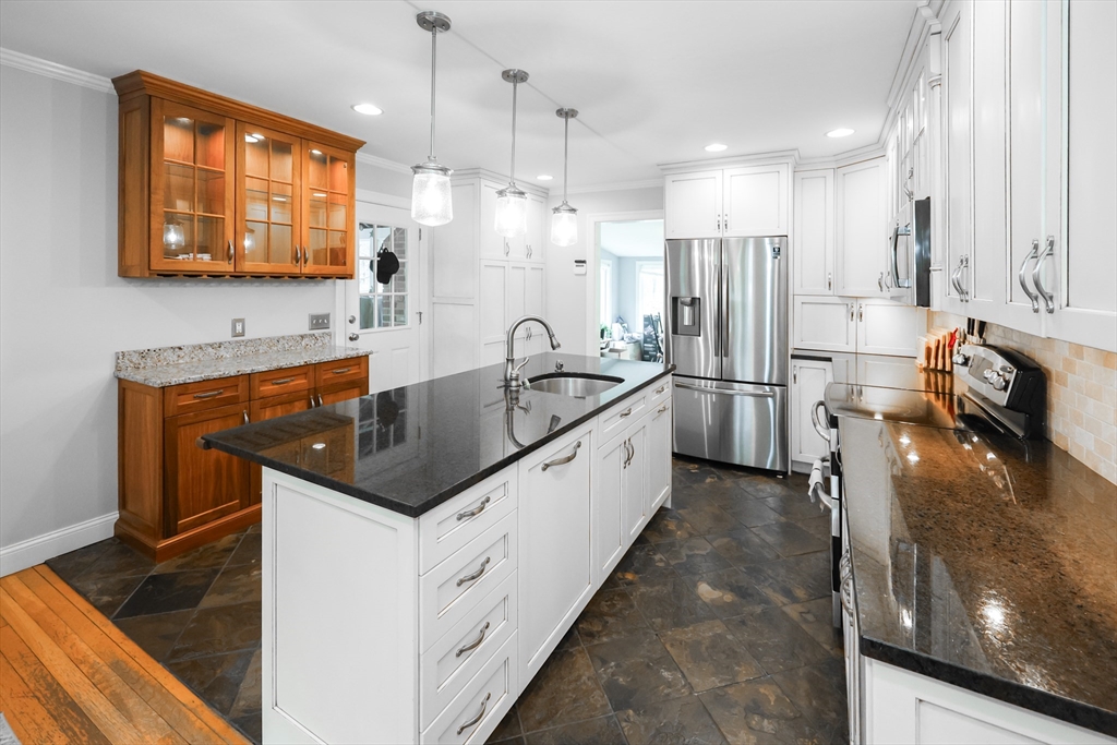 170 New Estate Road Littleton, MA 01460 - Photo 6 of 28 a kitchen with granite countertop a sink stove and refrigerator