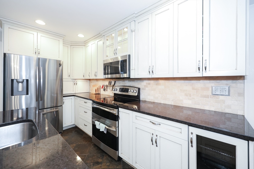 170 New Estate Road Littleton, MA 01460 - Photo 7 of 28 a kitchen with stainless steel appliances granite countertop a refrigerator sink and stove