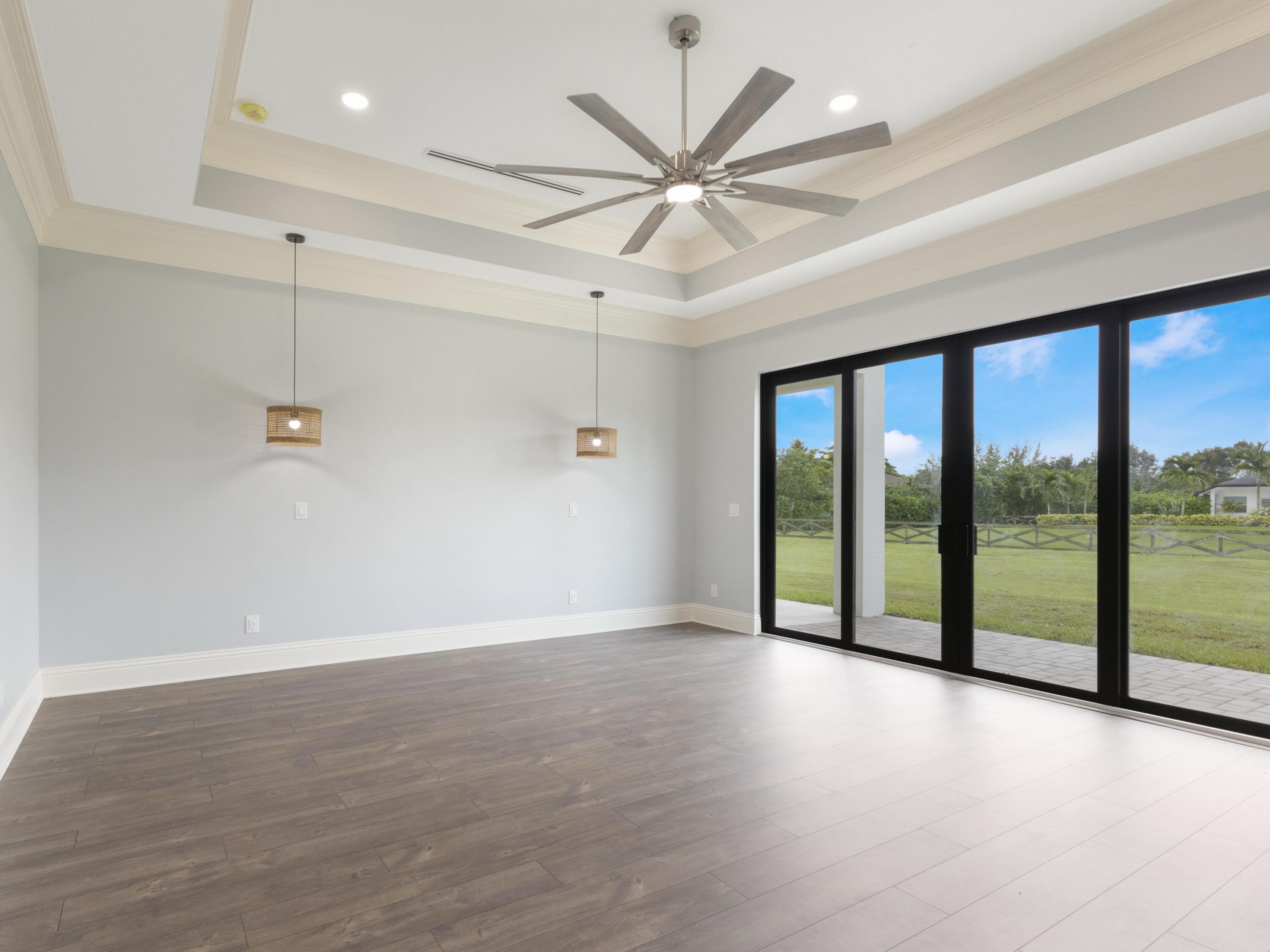 17436 71st Lane North Loxahatchee, FL 33470 - Photo 28 of 50 a view of a livingroom with a ceiling fan and window