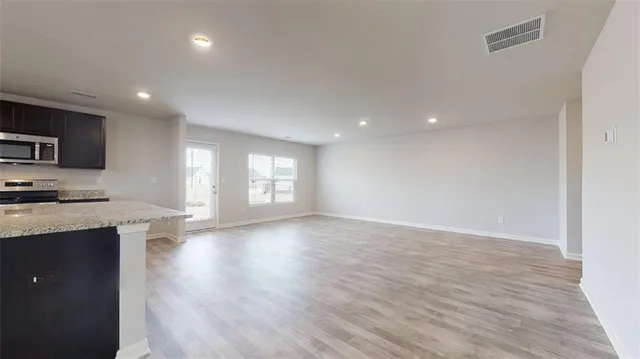 a view of a kitchen with a sink and a window