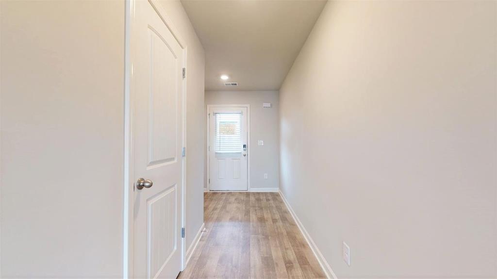 121 Weldon Road McDonough, GA 30253 - Photo 18 of 32 a view of a room with wooden floor and a hallway