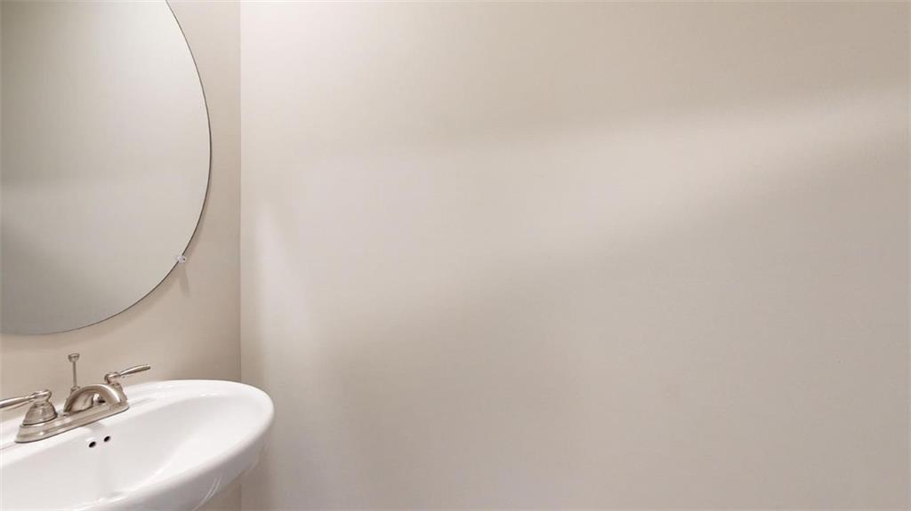 121 Weldon Road McDonough, GA 30253 - Photo 19 of 32 a bathroom with a sink and mirror
