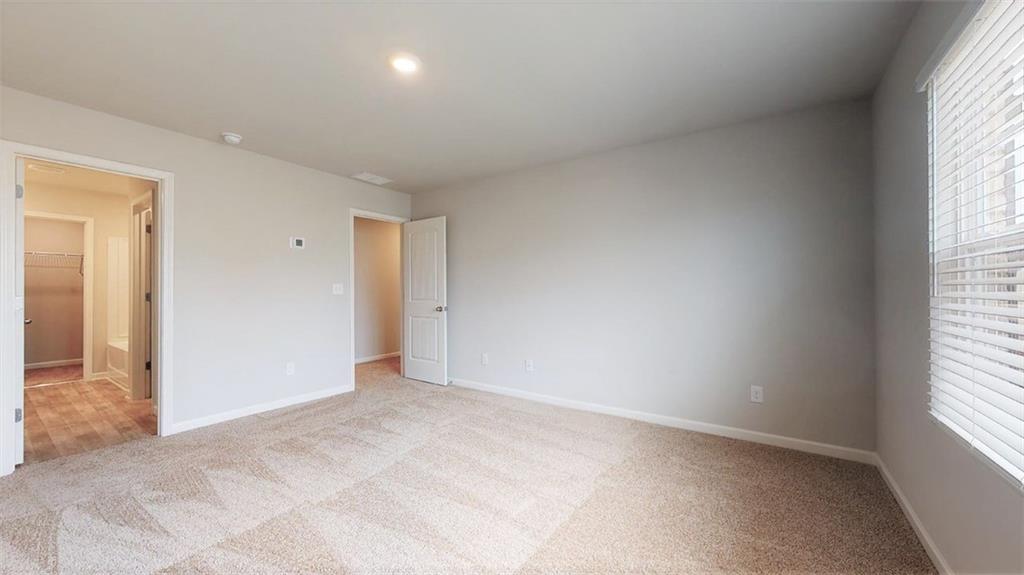 121 Weldon Road McDonough, GA 30253 - Photo 20 of 32 an empty room with windows