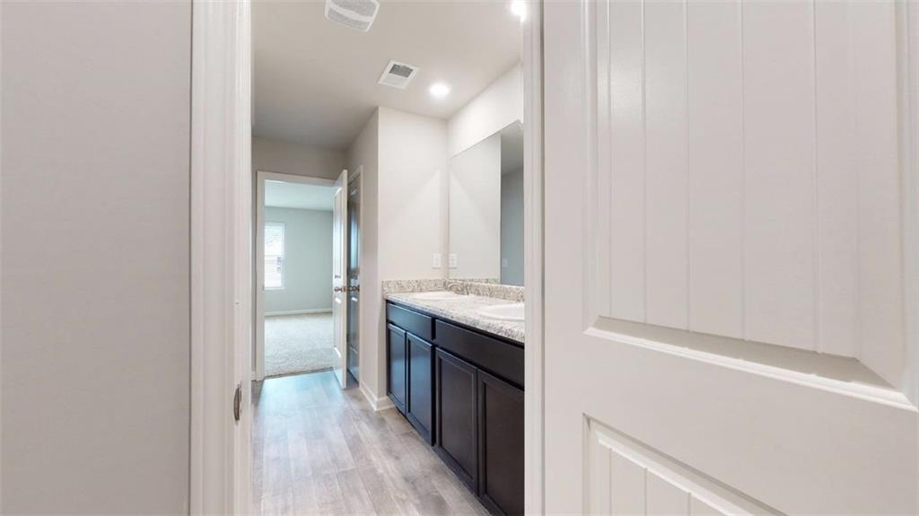 121 Weldon Road McDonough, GA 30253 - Photo 26 of 32 a bathroom with a sink and a mirror