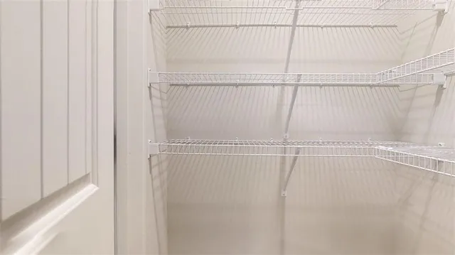 a view of a room with racks on the wall