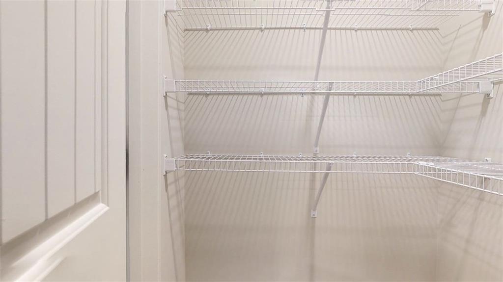 121 Weldon Road McDonough, GA 30253 - Photo 7 of 32 a view of a room with racks on the wall