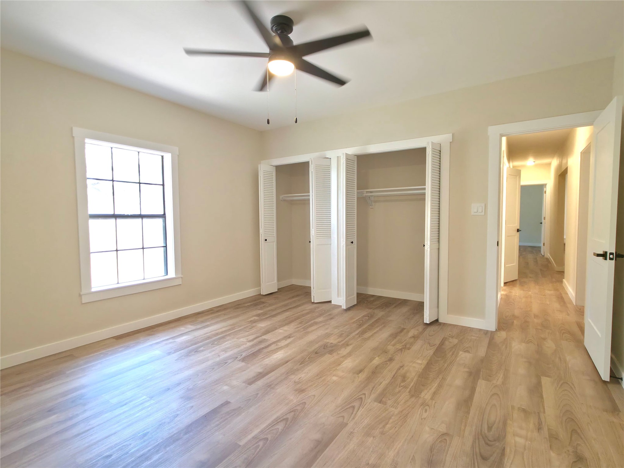109 Cernosek Road La Grange, TX 78945 - Photo 18 of 32 a view of empty room with wooden floor and fan