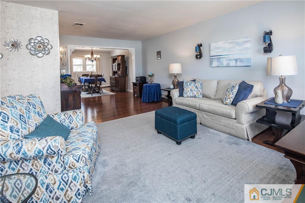 207 South Hill Road Colonia, NJ 07067 - Photo 13 of 47 a living room with furniture and a chandelier