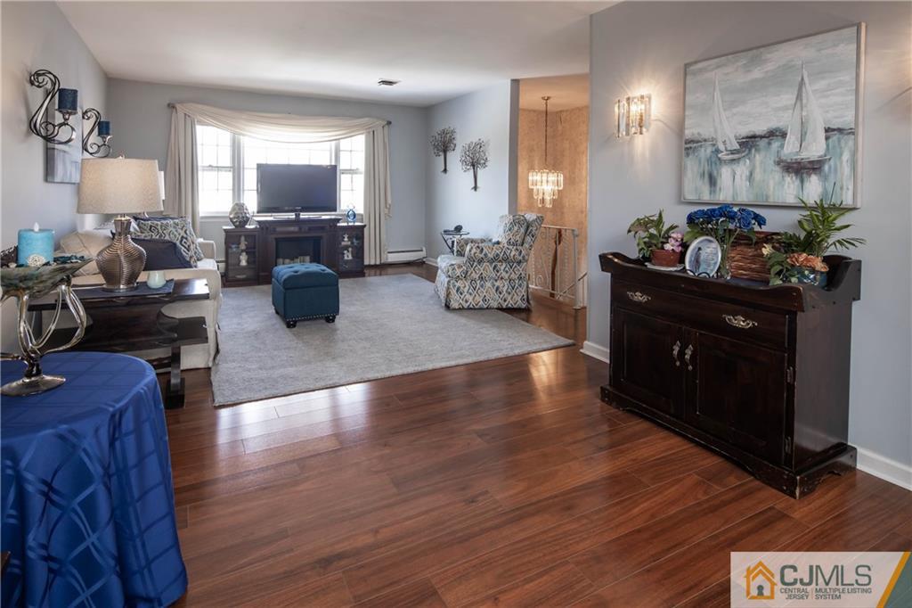 207 South Hill Road Colonia, NJ 07067 - Photo 15 of 47 a living room with furniture and a wooden floor