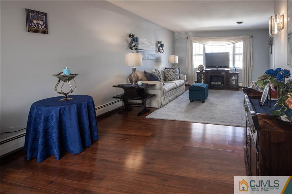207 South Hill Road Colonia, NJ 07067 - Photo 16 of 47 a living room with furniture and a mirror