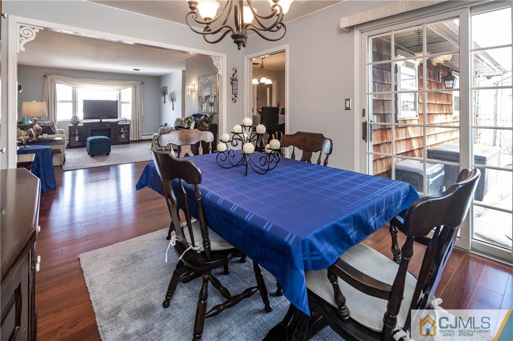 207 South Hill Road Colonia, NJ 07067 - Photo 18 of 47 a view of a dining room with furniture window and wooden floor