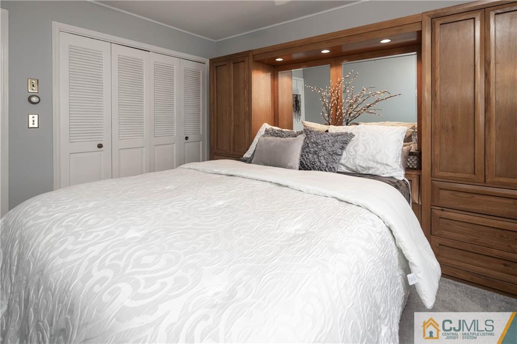 207 South Hill Road Colonia, NJ 07067 - Photo 20 of 47 a large white bed in a bedroom next to a window