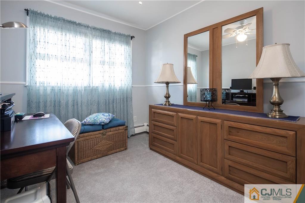 207 South Hill Road Colonia, NJ 07067 - Photo 21 of 47 a room with furniture window and a lamp