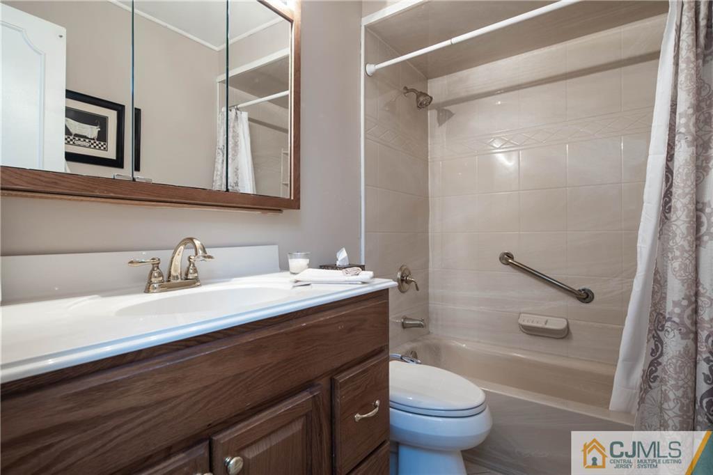 207 South Hill Road Colonia, NJ 07067 - Photo 22 of 47 a bathroom with a granite countertop sink toilet and shower