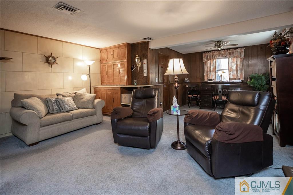 207 South Hill Road Colonia, NJ 07067 - Photo 28 of 47 a living room with furniture and a ceiling fan