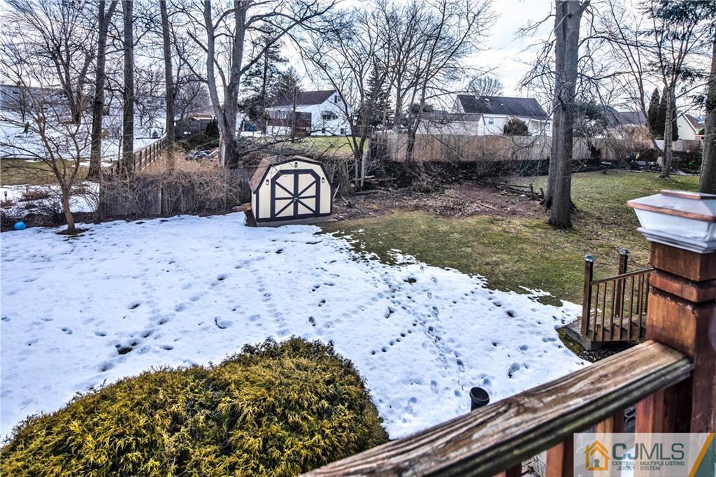 207 South Hill Road Colonia, NJ 07067 - Photo 38 of 47 a view of a wooden street with a snow on the road