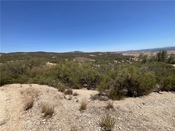 a view of a mountain view with mountains in the background