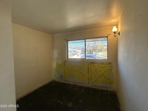 a view of an empty room and window
