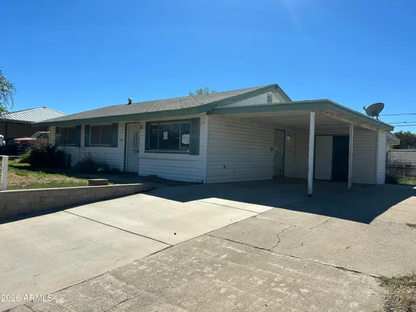 a front view of a house with yard