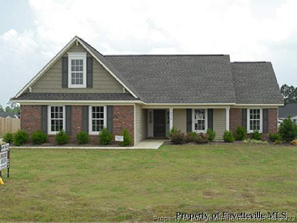 6613 Valley Falls Road Hope Mills, NC 28348 - Photo 1 of 7 a front view of a house with a yard