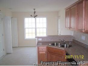 6613 Valley Falls Road Hope Mills, NC 28348 - Photo 3 of 7 a view of kitchen with granite countertop cabinets