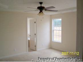 6613 Valley Falls Road Hope Mills, NC 28348 - Photo 6 of 7 a view of an empty room and a window
