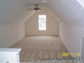 6613 Valley Falls Road Hope Mills, NC 28348 - Photo 7 of 7 a view of room with a ceiling fan and window