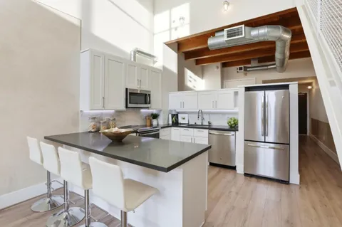 a kitchen with sink and window