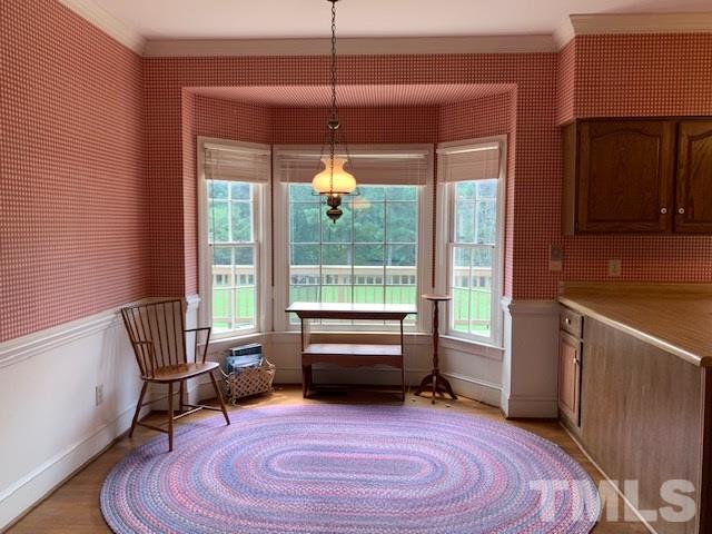 717 Brookfield Road Raleigh, NC 27615 - Photo 14 of 30 a bedroom with furniture and a large window